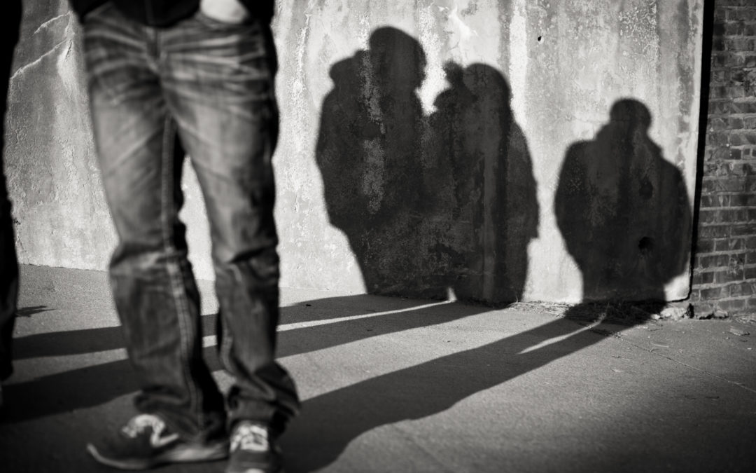 Teenage boys shadow against wall Release Inc